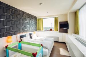 Postel nebo postele na pokoji v ubytování harry's home Wien hotel & apartments