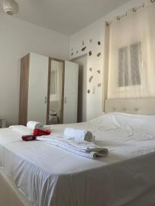 Ένα ή περισσότερα κρεβάτια σε δωμάτιο στο Olympio Luxury Studio Paros