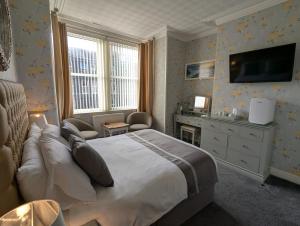 TV a/nebo společenská místnost v ubytování Valentine Lodge Over 21 Adult Couples Only