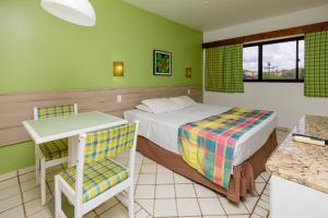 Ένα ή περισσότερα κρεβάτια σε δωμάτιο στο El Aram Beach Cabo - All Inclusive