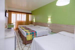 Ένα ή περισσότερα κρεβάτια σε δωμάτιο στο El Aram Beach Cabo - All Inclusive +2 φωτογραφίες