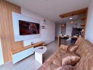 a living room with a couch and a table at Nuevo apartamento moderno, espectacular vista in Manizales