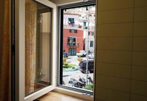a window in a room with a view of a street at Well in House Casa Vacanze in Cetara +13 photos