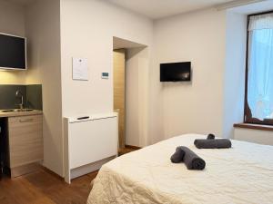 Giường trong phòng chung tại La Casa in Piazza - Edolo