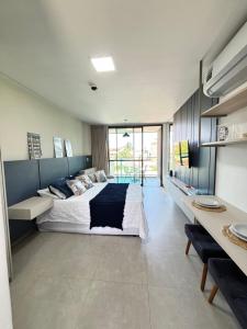 En eller flere senge i et værelse på Beach Class Summer - Porto de Galinhas