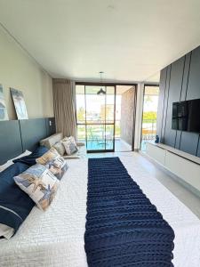 En eller flere senge i et værelse på Beach Class Summer - Porto de Galinhas + 40 billeder