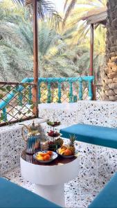 a table with fruit on it on a balcony at Casa Blanca - calm space for soul revival in Ādam +83 photos