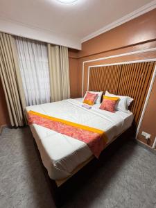 Ένα ή περισσότερα κρεβάτια σε δωμάτιο στο Maks Homely Haven