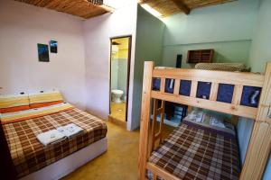 Ένα ή περισσότερα κρεβάτια σε δωμάτιο στο Tilcara Mistica Hostel