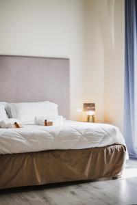 Postel nebo postele na pokoji v ubytování Hotel San Nicola