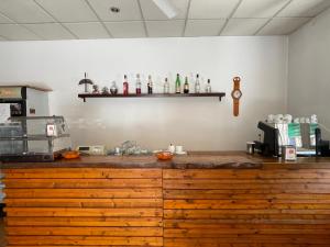 a kitchen with a wooden counter top in a room at La Locanda del Re in Crevalcore