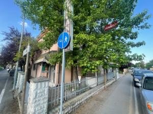 a blue street sign in front of a building at La Locanda del Re in Crevalcore
