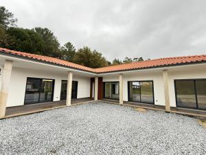 a house with a lot of windows and a building at Calcedonia House - Gerês in Terras de Bouro