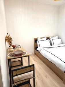 Ένα ή περισσότερα κρεβάτια σε δωμάτιο στο Studio Luz