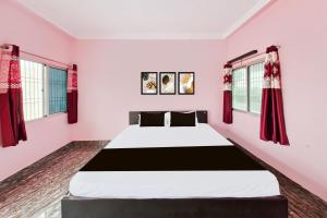 Ένα ή περισσότερα κρεβάτια σε δωμάτιο στο Hotel O Royal Heritage Resort