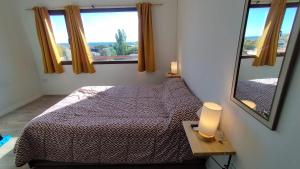 En eller flere senge i et værelse på Cabaña del Mirador 5