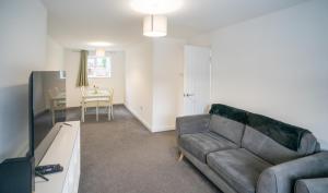 Et tv og/eller underholdning på Modern 3 Bedroom Home Ideal for Families and Business Stays