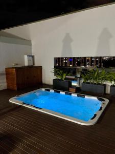 Бассейн в Moderno apartamendo con Rooftop y Jacuzi или поблизости