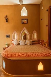 a bedroom with a large bed in a room at VVIP GAJBAN Resort in Bikaner +49 photos