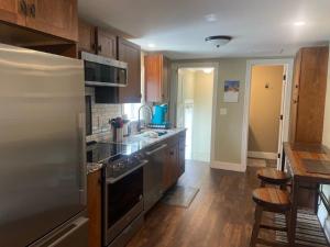 a kitchen with stainless steel appliances and wooden cabinets at 855 N Grant Ave in Loveland