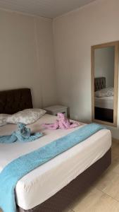 En eller flere senge i et værelse på Cantinho do Aconchego