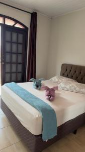 En eller flere senge i et værelse på Cantinho do Aconchego