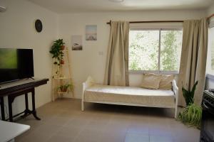 Et tv og/eller underholdning på Apart Altos de Ensueño