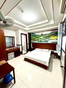 Ένα ή περισσότερα κρεβάτια σε δωμάτιο στο Hotel Hoàng Thiên Lộc