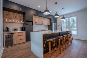 Køkken eller tekøkken på Le Birdie spa et sauna