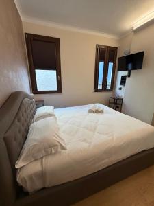 Ένα ή περισσότερα κρεβάτια σε δωμάτιο στο Le Stanze Del Duca