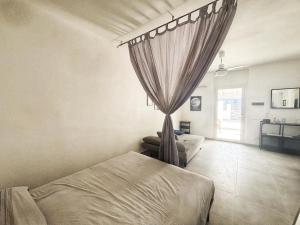 Ένα ή περισσότερα κρεβάτια σε δωμάτιο στο Vulcano Island Houses