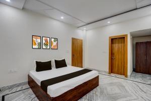 Ένα ή περισσότερα κρεβάτια σε δωμάτιο στο Hotel O Pristine inn