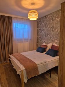 Giường trong phòng chung tại Apartament na Mierzei