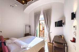 TV a/nebo společenská místnost v ubytování Le Sei Porte