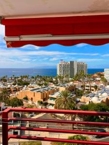 a view of a city from a balcony at Olimpia Sunset Studio in Costa de Adeje