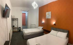 Ένα ή περισσότερα κρεβάτια σε δωμάτιο στο Savoy Hotel