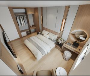 an overhead view of a bedroom with a large bed at Lam Anh Hotel 9 Him Lam Vạn Phúc in Hà Ðông