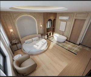 a large room with a bed and a tub in it at Lam Anh Hotel 9 Him Lam Vạn Phúc in Hà Ðông