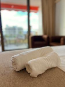 a white towel laying on the floor in a room at Olimpia Sunset Studio in Costa de Adeje