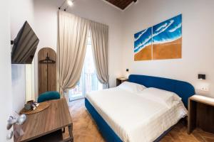 Postel nebo postele na pokoji v ubytování Le Sei Porte