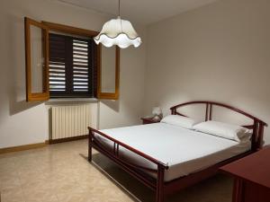 En eller flere senge i et værelse på Villa Eleonora