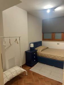 Ένα ή περισσότερα κρεβάτια σε δωμάτιο στο Casa Lido di Camaiore Eva&Gabri