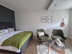 Postel nebo postele na pokoji v ubytování Trendy Studio Apartment in On Park