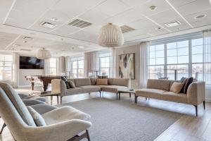 a living room with couches and a pool table at Blueground Hudson Exchange pool nr Liberty Park NYC-2174 in Hoboken