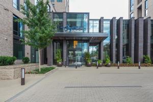 a building with a sign on the front of it at Blueground Hunter Mill District pool nr Lake Anne WDC-844 in Reston