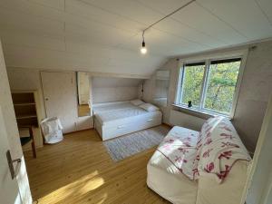 En eller flere senge i et værelse på Holiday home Hönstorp