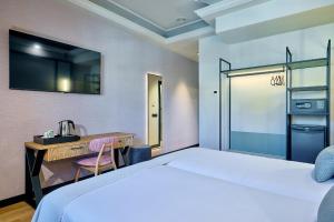 Postel nebo postele na pokoji v ubytování Boutique Hotel Luna Triunfo Granada