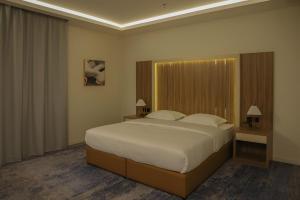 Ένα ή περισσότερα κρεβάτια σε δωμάτιο στο عريش باركـ