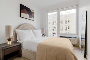 Postel nebo postele na pokoji v ubytování Blueground Boerum Hill rooftop nr Brooklyn Bridge NYC-2184 + 16 fotografií