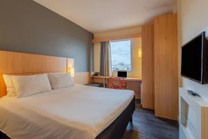 TV a/nebo společenská místnost v ubytování Transamerica Fit Aracruz